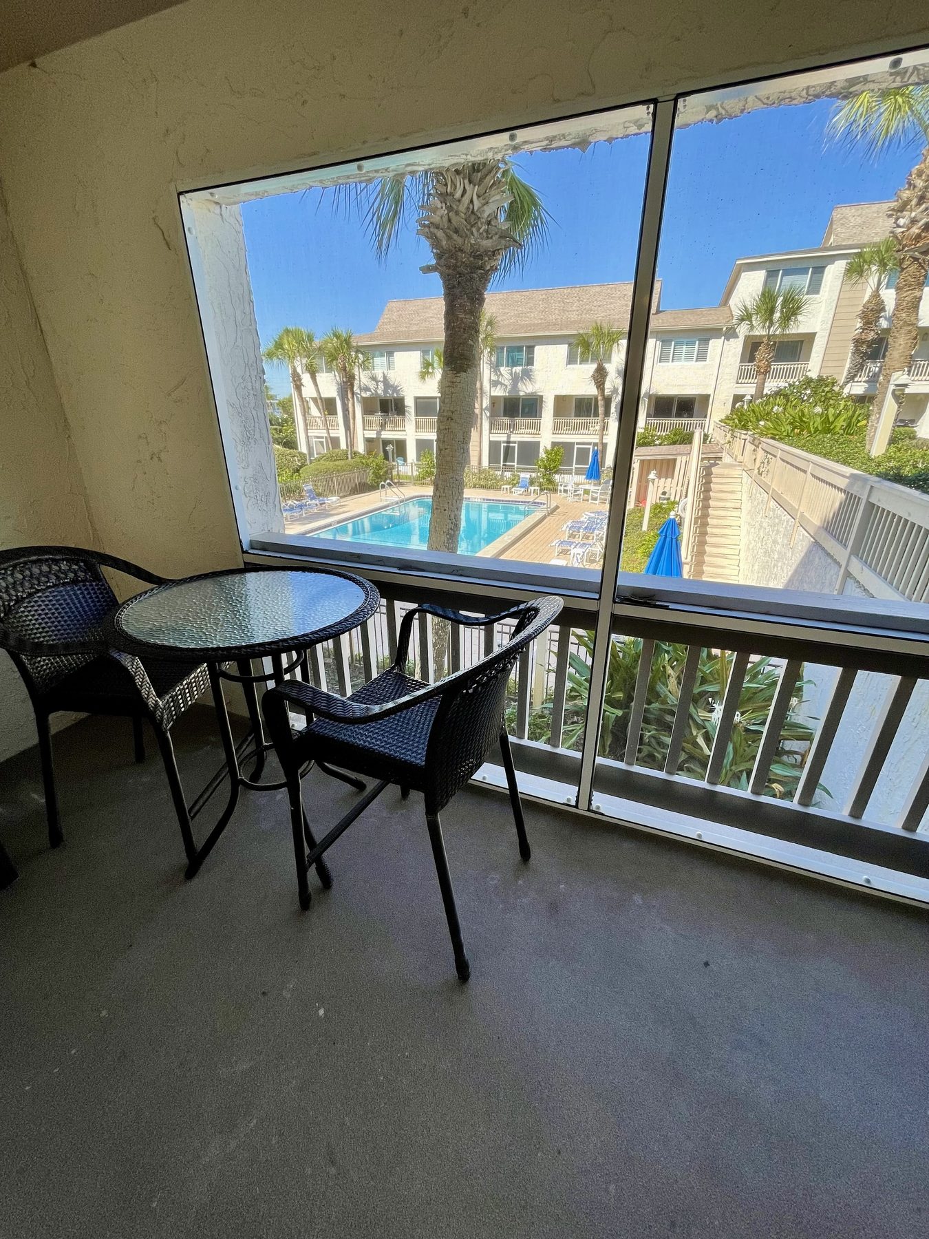 Screened patio overlooking the pool
